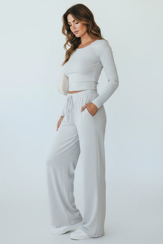 BOJU women's light grey long sleeve crop top and wide-leg pants yoga set made of soft, stretchy knit fabric.
